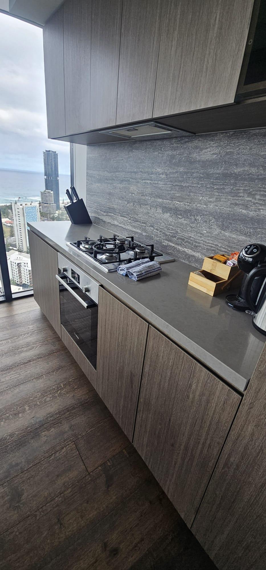 Degreased gas cooktop and oven after kitchen deep clean