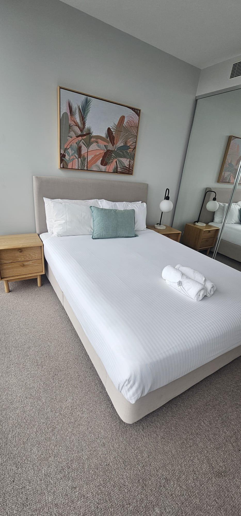 Perfectly made bed after a Blue On Time turnover clean